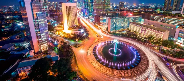 Jakarta city skyline at night with Bundaran HI